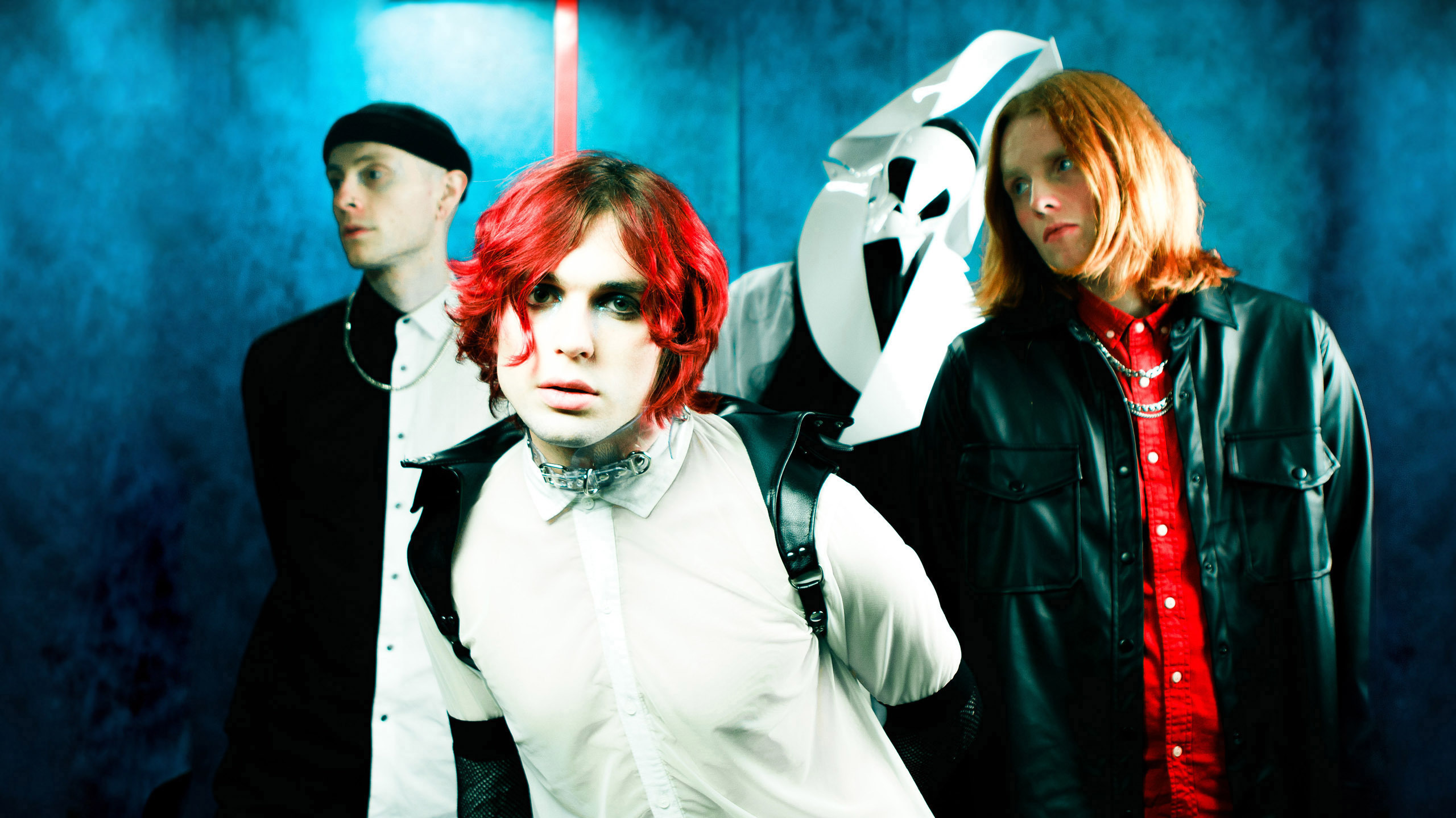 a group photo of the band static dress