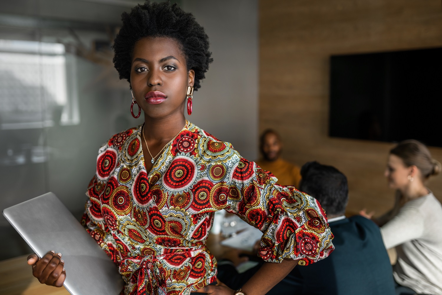 Maya:a picture of a black women holding a laptop