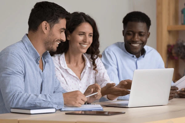 a group of 3 interns working together