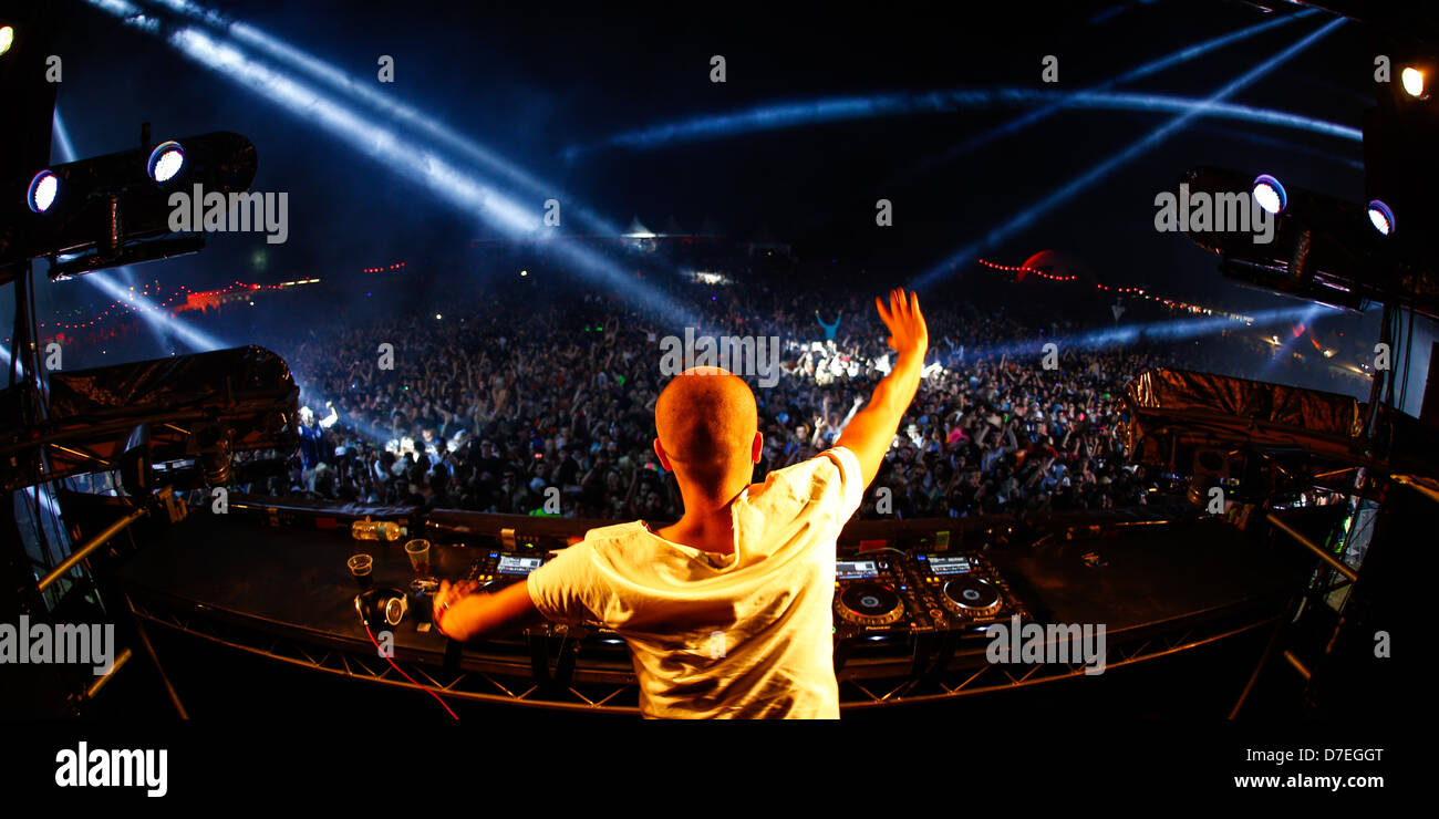 A DJ waving to a crowd