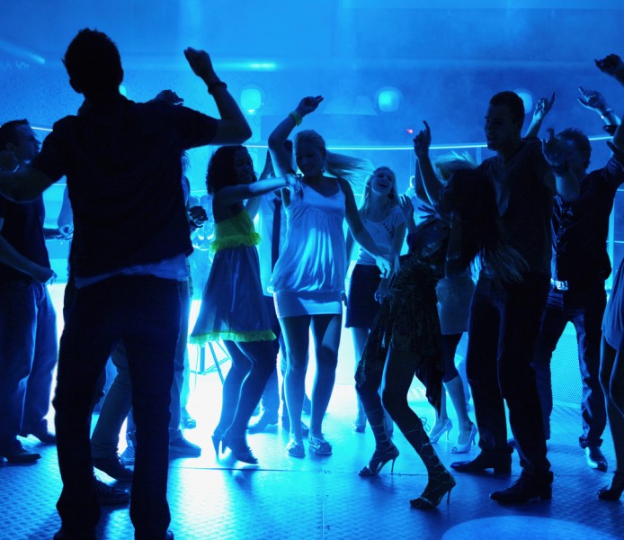 students at school event dancing