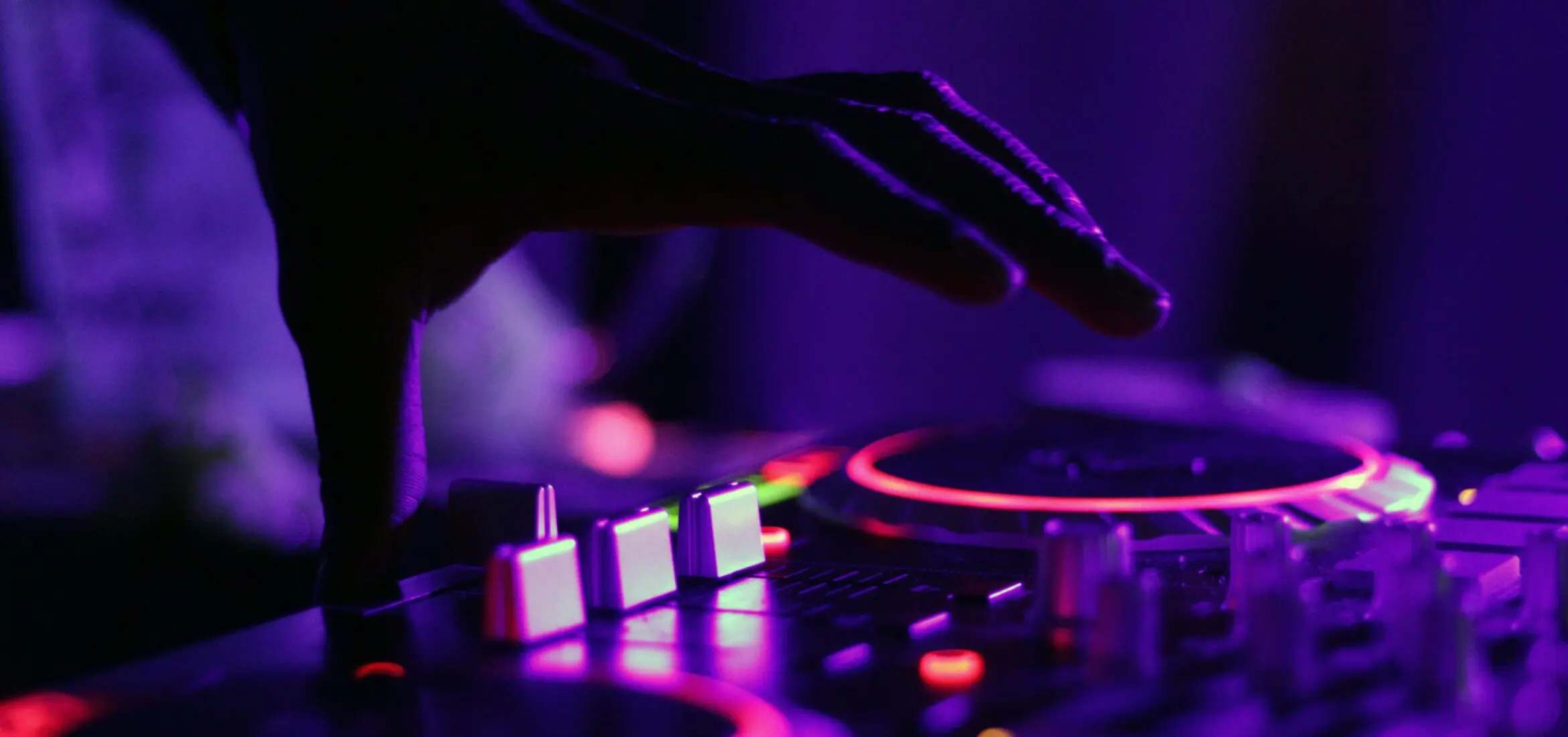 DJ in colored lighting